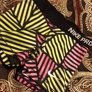Nike Women's Black, Yellow, and Pink Striped Shorts